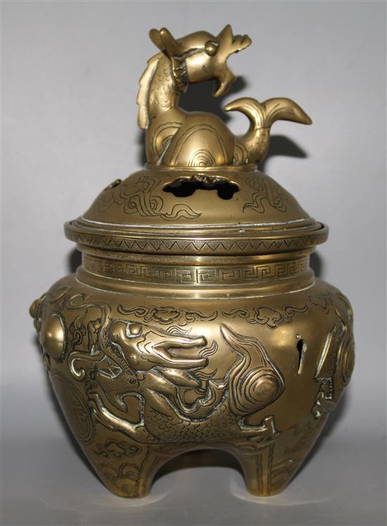 An Oriental brass censor